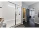 Modern bathroom features a glass enclosed shower with a built-in bench and neutral tile at 3599 Chalmers Dr, Bargersville, IN 46106