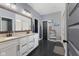 Elegant bathroom featuring double vanity sinks, stylish mirror, and modern fixtures at 3599 Chalmers Dr, Bargersville, IN 46106