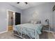 A cozy bedroom features a floral bedspread and neutral decor, creating a relaxing space at 3599 Chalmers Dr, Bargersville, IN 46106