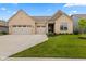 Charming single-story home featuring a manicured lawn and a spacious three-car garage at 3599 Chalmers Dr, Bargersville, IN 46106