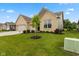 Attractive home with a well-kept lawn, a three-car garage, and inviting curb appeal at 3599 Chalmers Dr, Bargersville, IN 46106