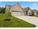 Well-maintained home with a three-car garage, a lush lawn, and tasteful landscaping at 3599 Chalmers Dr, Bargersville, IN 46106