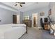 Spacious main bedroom with a fireplace, TV, and a view into an ensuite bathroom and walk-in closet at 3599 Chalmers Dr, Bargersville, IN 46106