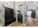 Mudroom with a bench and coat hooks leading to a laundry area and other rooms at 3599 Chalmers Dr, Bargersville, IN 46106