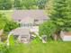 Aerial view of backyard featuring a deck, pergola, and beautifully landscaped garden, perfect for outdoor relaxation at 391 W 500 S, Anderson, IN 46013