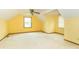 Attic bedroom featuring two windows for natural light and soft carpeting at 391 W 500 S, Anderson, IN 46013