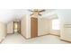 Attic bedroom featuring a ceiling fan, neutral carpeting, and closet at 391 W 500 S, Anderson, IN 46013