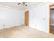 Carpeted bedroom with neutral walls, wood trim, and ceiling fan at 391 W 500 S, Anderson, IN 46013
