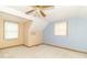 Attic bedroom with a ceiling fan, carpeting, a window, and blue accent wall at 391 W 500 S, Anderson, IN 46013