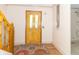 Welcoming entryway featuring a decorative front door, hardwood floors, and a stylish area rug, creating a warm ambiance at 391 W 500 S, Anderson, IN 46013