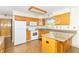 Bright kitchen featuring modern appliances, wooden cabinets, and durable countertops, providing ample space for cooking at 391 W 500 S, Anderson, IN 46013