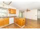 Open kitchen featuring wood cabinets, an island with a breakfast bar, and modern appliances, offering great functionality at 391 W 500 S, Anderson, IN 46013