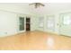 Bright sunroom with lots of natural light, multiple windows, sliding glass door, and a ceiling fan at 391 W 500 S, Anderson, IN 46013