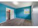 This bedroom features neutral carpet, a closet, and ample natural light at 406 W Mcgregor Rd, Indianapolis, IN 46217