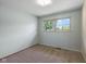 Bedroom has neutral carpet and natural light at 406 W Mcgregor Rd, Indianapolis, IN 46217