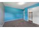 Bedroom features neutral carpet, a closet, and ample natural light at 406 W Mcgregor Rd, Indianapolis, IN 46217