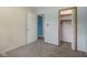 Bedroom features neutral carpet, a closet, and adjoining room at 406 W Mcgregor Rd, Indianapolis, IN 46217
