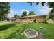 Charming one-story home with brick accents, manicured lawn, flowerbeds, and bird bath at 406 W Mcgregor Rd, Indianapolis, IN 46217