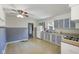 Functional kitchen design with tile flooring, ample counter space, and views into other rooms at 406 W Mcgregor Rd, Indianapolis, IN 46217