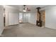 Inviting living room featuring a wood-burning stove, carpet flooring, and neutral color palette at 406 W Mcgregor Rd, Indianapolis, IN 46217
