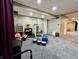 Open basement with carpet, storage units, and drum set visible, leading to a bar area at 419 N 14Th Ave, Beech Grove, IN 46107