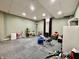 Spacious carpeted basement with a drum set, toys, and play equipment, offering ample space for activities at 419 N 14Th Ave, Beech Grove, IN 46107