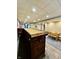 Finished basement featuring a wooden bar with barstools and additional seating area at 419 N 14Th Ave, Beech Grove, IN 46107