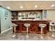 Finished basement bar with wood countertop, decor and seating at 419 N 14Th Ave, Beech Grove, IN 46107