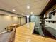 Finished basement bar with shelves, wine storage, and room for guests at 419 N 14Th Ave, Beech Grove, IN 46107