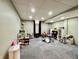 Wide view of basement playroom with carpet, recessed lighting, drum set, and assorted toys at 419 N 14Th Ave, Beech Grove, IN 46107
