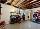 Basement area featuring concrete floor, open ceiling, storage shelves, and doorway at 419 N 14Th Ave, Beech Grove, IN 46107