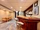 Finished basement with bar and table with chairs at 419 N 14Th Ave, Beech Grove, IN 46107