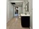 Bathroom featuring tile flooring, vanity with cabinet, mirror, and open doorway at 419 N 14Th Ave, Beech Grove, IN 46107