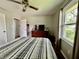 Bedroom features hardwood floors, neutral paint and a nice view from the window at 419 N 14Th Ave, Beech Grove, IN 46107