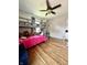 Comfortable bedroom featuring hardwood floors, ceiling fan, and bunk beds at 419 N 14Th Ave, Beech Grove, IN 46107