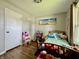 Comfortable bedroom featuring hardwood floors, neutral paint, and a cozy atmosphere at 419 N 14Th Ave, Beech Grove, IN 46107