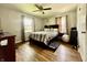 Bedroom with wood floors, neutral paint, and a ceiling fan at 419 N 14Th Ave, Beech Grove, IN 46107