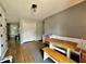 Dining area features hardwood flooring, gray walls, a breakfast nook, and direct access to the entry way at 419 N 14Th Ave, Beech Grove, IN 46107