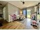 Dining area featuring hardwood floors, a breakfast nook, and a doorway leading to the backyard at 419 N 14Th Ave, Beech Grove, IN 46107