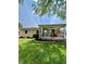 Charming single-story brick home with a covered front porch, landscaped yard, and American flag at 419 N 14Th Ave, Beech Grove, IN 46107