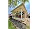 Charming single-story brick home featuring a covered front porch with black railing and an American flag at 419 N 14Th Ave, Beech Grove, IN 46107