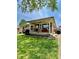 Charming front porch with well-kept landscape and American flag at 419 N 14Th Ave, Beech Grove, IN 46107