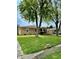 Residential home with mature trees and green lawn at 419 N 14Th Ave, Beech Grove, IN 46107