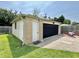 Exterior view of the detached garage with painted door at 419 N 14Th Ave, Beech Grove, IN 46107
