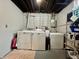Laundry area in basement featuring washer, dryer, freezer, and wire rack for storage at 419 N 14Th Ave, Beech Grove, IN 46107