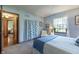 Comfortable bedroom with natural light, and blue accents create a relaxing space at 421 Kingsway Ct, Mooresville, IN 46158