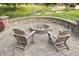 Charming outdoor fire pit and paver patio, perfect for entertaining guests in the backyard at 421 Kingsway Ct, Mooresville, IN 46158