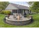 Enjoy the outdoors with a fire pit, patio, screened porch and spacious landscaped backyard at 421 Kingsway Ct, Mooresville, IN 46158