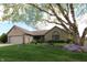 Charming brick ranch home with well-manicured lawn, mature trees, and a lovely front yard at 421 Kingsway Ct, Mooresville, IN 46158