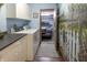 Functional laundry room with machines, cabinetry, and a charming mural of nature at 421 Kingsway Ct, Mooresville, IN 46158